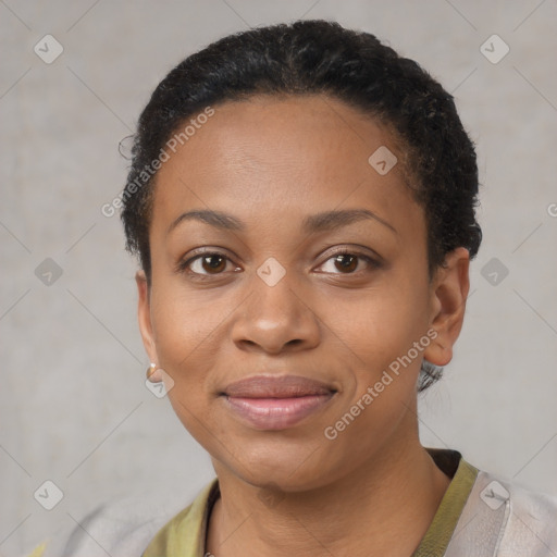 Joyful black young-adult female with short  black hair and brown eyes