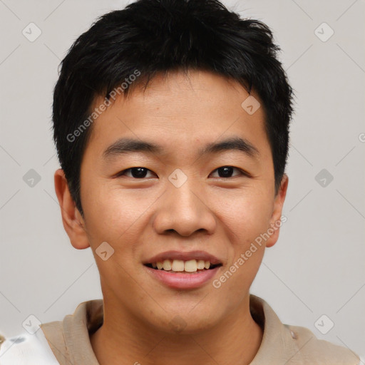 Joyful asian young-adult male with short  black hair and brown eyes