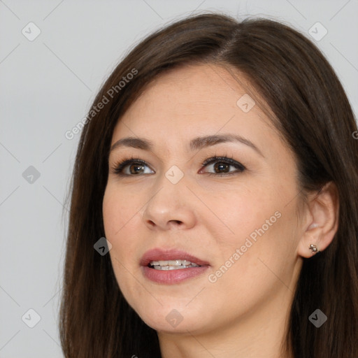 Joyful white young-adult female with long  brown hair and brown eyes