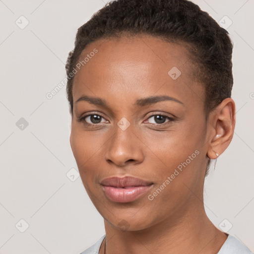 Joyful black young-adult female with short  brown hair and brown eyes