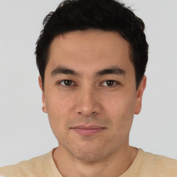 Joyful asian young-adult male with short  black hair and brown eyes