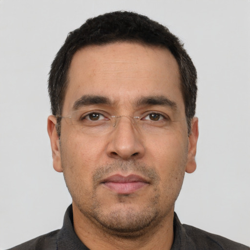 Neutral white adult male with short  black hair and brown eyes