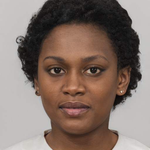 Neutral black young-adult female with short  brown hair and brown eyes