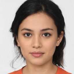 Joyful white young-adult female with medium  brown hair and brown eyes