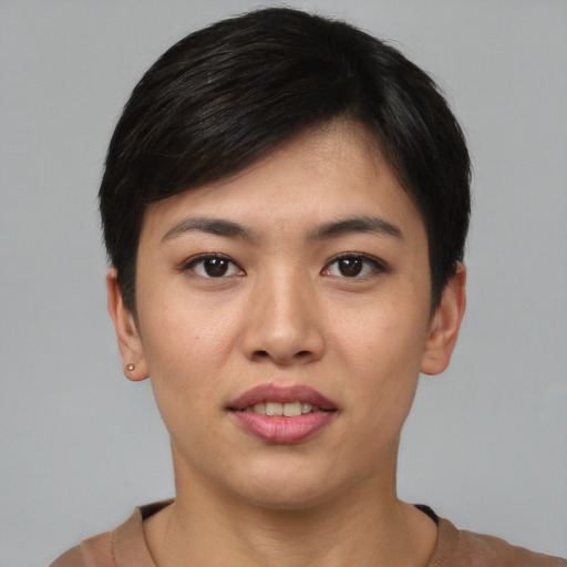 Joyful asian young-adult female with short  black hair and brown eyes