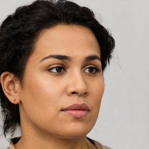 Neutral latino young-adult female with medium  brown hair and brown eyes