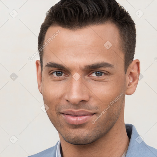 Joyful white young-adult male with short  brown hair and brown eyes