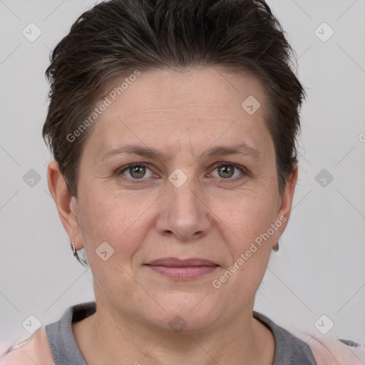 Joyful white adult female with short  brown hair and grey eyes