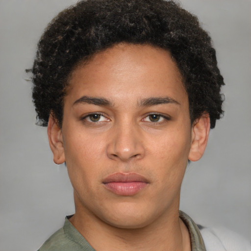 Joyful latino young-adult male with short  brown hair and brown eyes