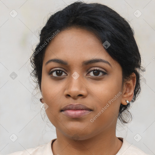 Joyful latino young-adult female with medium  brown hair and brown eyes