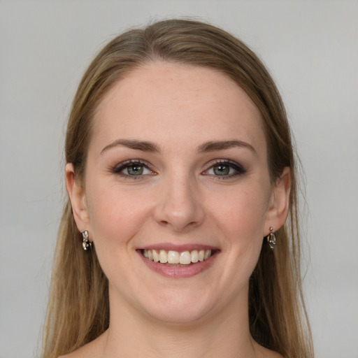 Joyful white young-adult female with long  brown hair and grey eyes