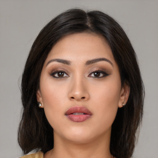 Neutral asian young-adult female with medium  brown hair and brown eyes