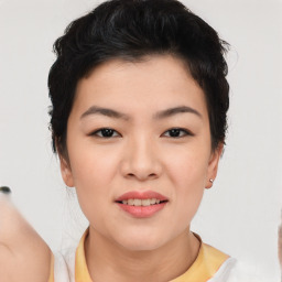 Joyful asian young-adult female with short  black hair and brown eyes