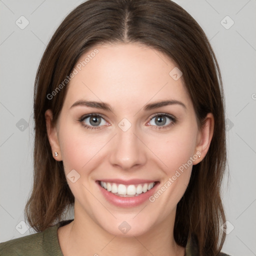 Joyful white young-adult female with long  brown hair and grey eyes