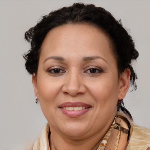 Joyful latino adult female with short  brown hair and brown eyes