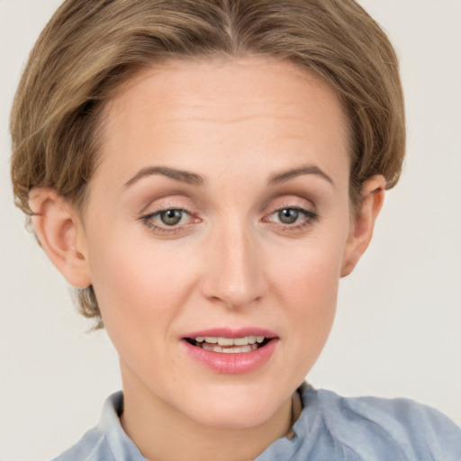 Joyful white young-adult female with medium  brown hair and grey eyes