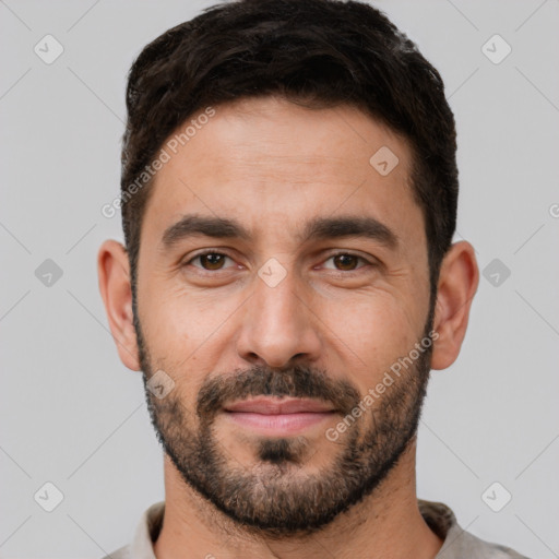 Joyful white young-adult male with short  black hair and brown eyes