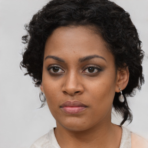 Neutral black young-adult female with medium  black hair and brown eyes