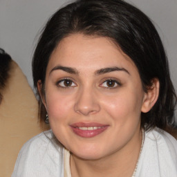 Joyful white young-adult female with medium  brown hair and brown eyes