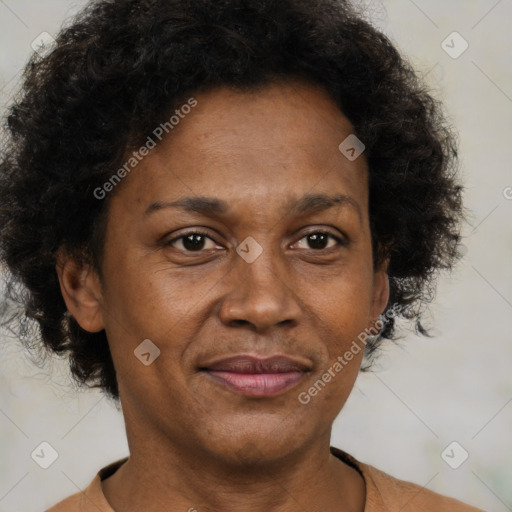 Joyful black adult female with short  brown hair and brown eyes