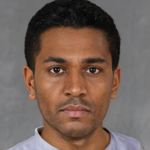 Neutral black young-adult male with short  black hair and brown eyes
