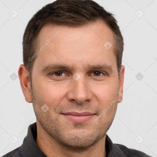 Joyful white adult male with short  brown hair and brown eyes