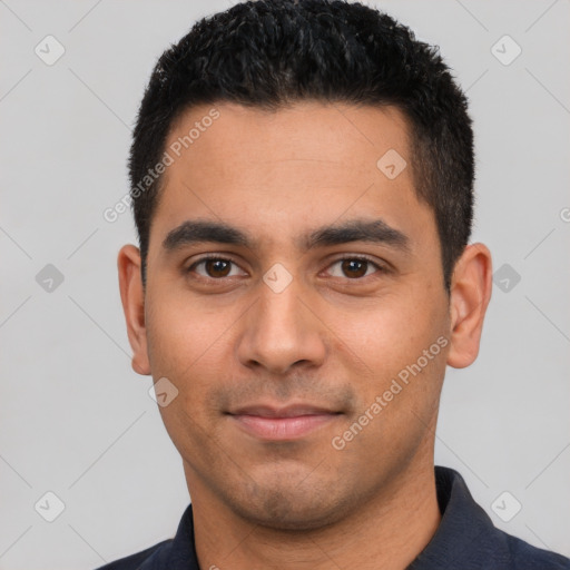 Joyful latino young-adult male with short  black hair and brown eyes