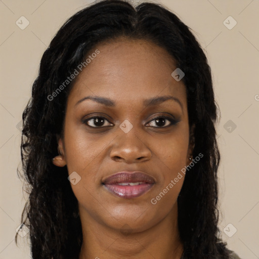 Joyful black young-adult female with long  brown hair and brown eyes