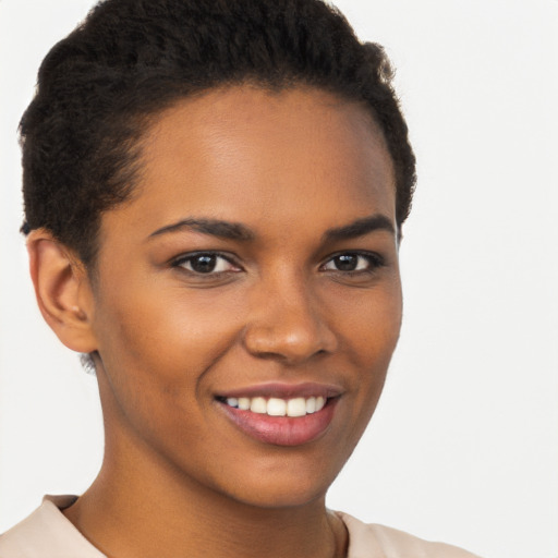 Joyful black young-adult female with short  brown hair and brown eyes