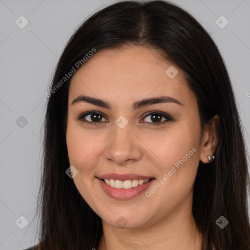 Joyful white young-adult female with long  brown hair and brown eyes