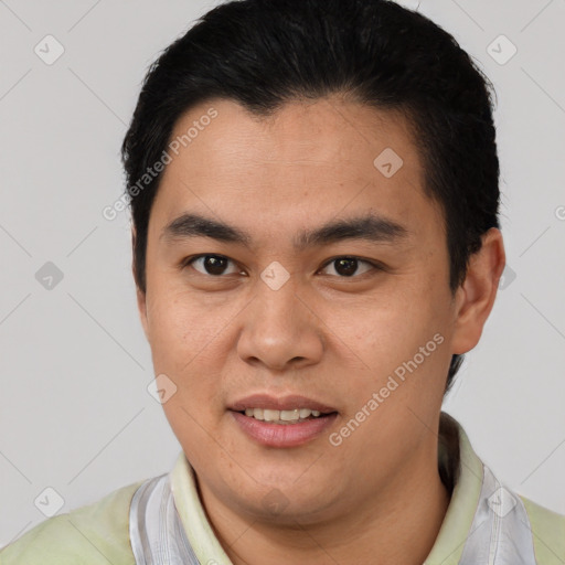 Joyful white young-adult male with short  black hair and brown eyes