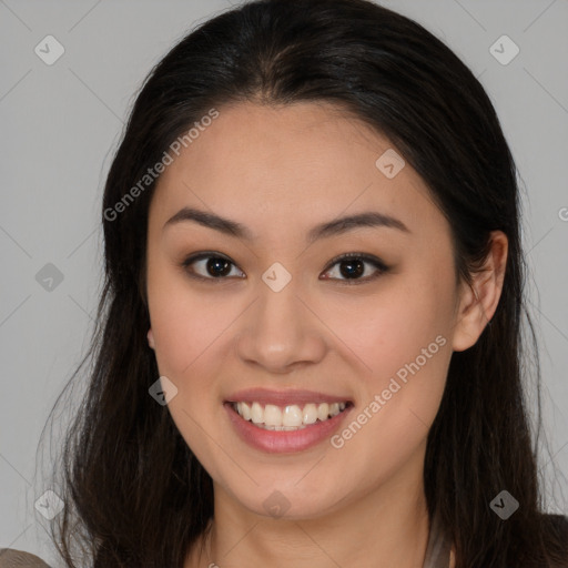 Joyful asian young-adult female with long  brown hair and brown eyes