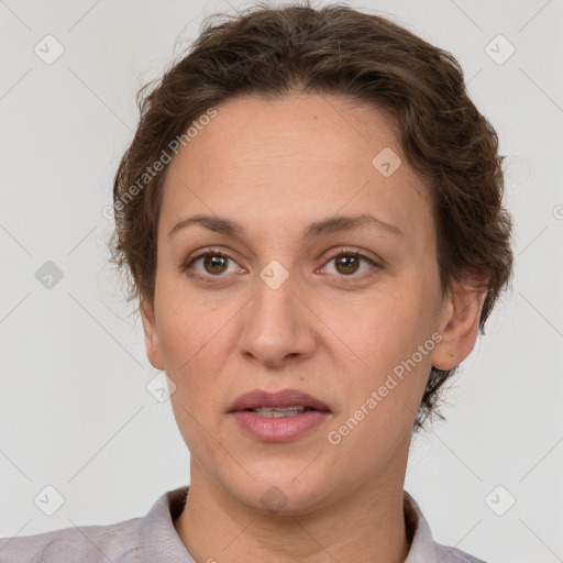 Joyful white adult female with short  brown hair and brown eyes