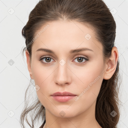 Neutral white young-adult female with long  brown hair and brown eyes