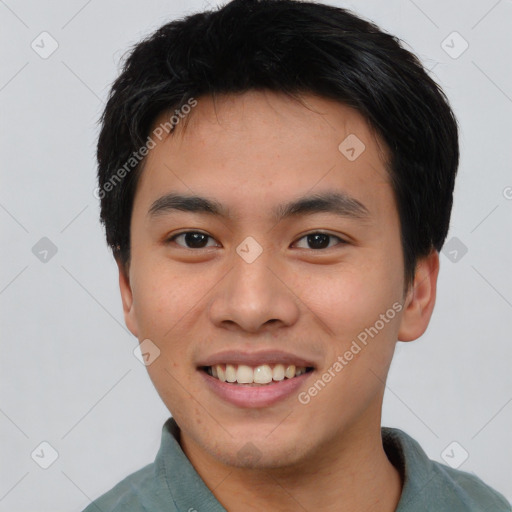 Joyful asian young-adult male with short  black hair and brown eyes