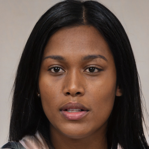 Joyful asian young-adult female with long  black hair and brown eyes