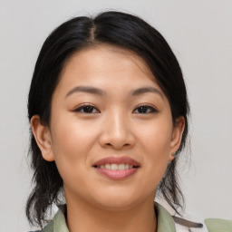 Joyful asian young-adult female with medium  brown hair and brown eyes