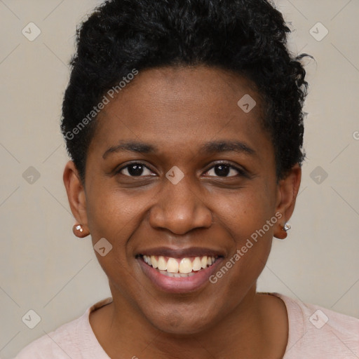 Joyful black young-adult female with short  black hair and brown eyes