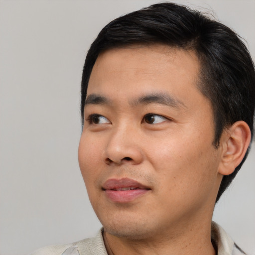 Neutral asian young-adult male with short  black hair and brown eyes