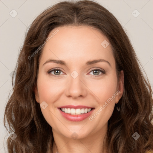 Joyful white young-adult female with long  brown hair and green eyes