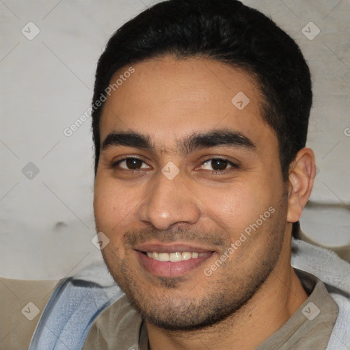 Joyful white young-adult male with short  black hair and brown eyes