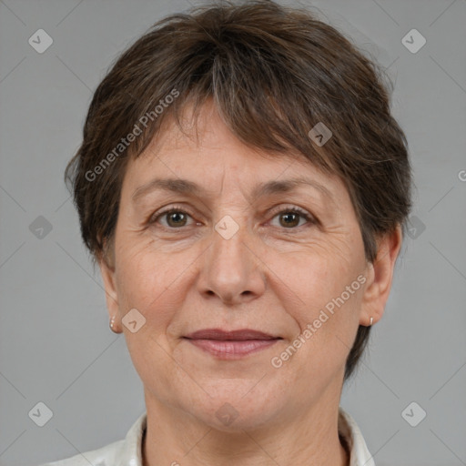 Joyful white adult female with short  brown hair and brown eyes