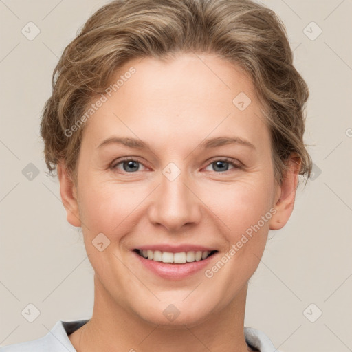 Joyful white young-adult female with short  brown hair and grey eyes