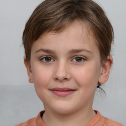 Joyful white child female with short  brown hair and grey eyes