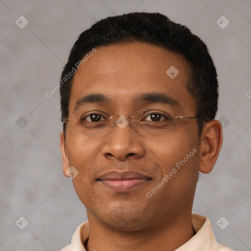 Joyful black young-adult male with short  black hair and brown eyes