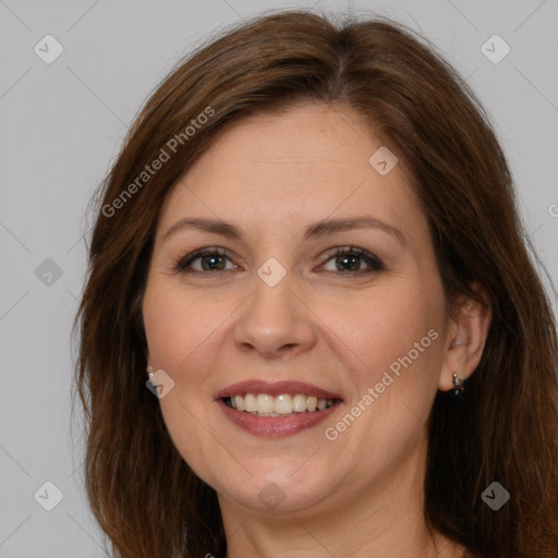 Joyful white adult female with long  brown hair and brown eyes