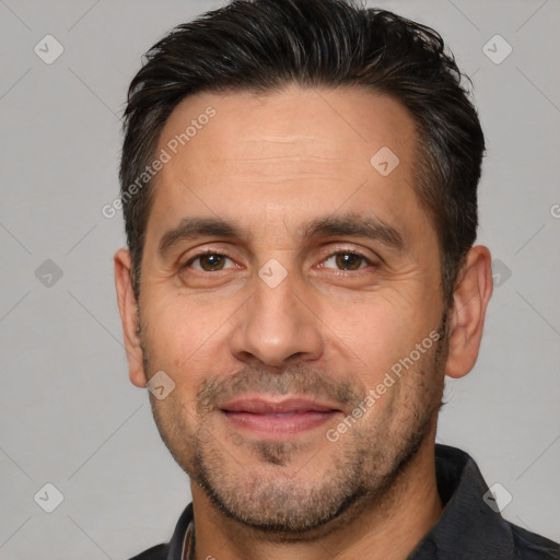 Joyful white adult male with short  brown hair and brown eyes