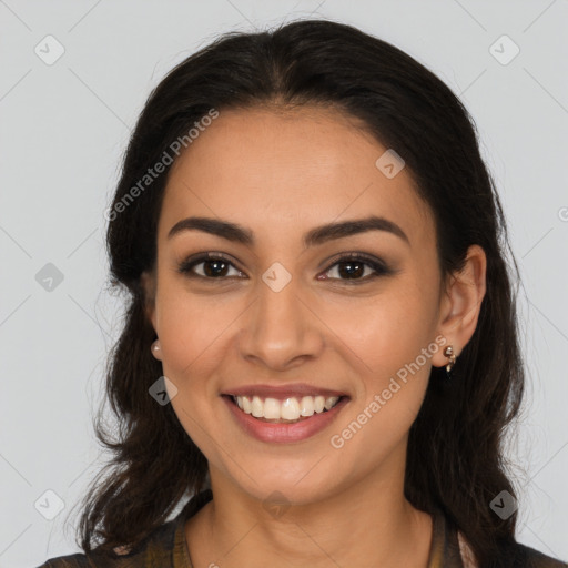 Joyful latino young-adult female with long  brown hair and brown eyes