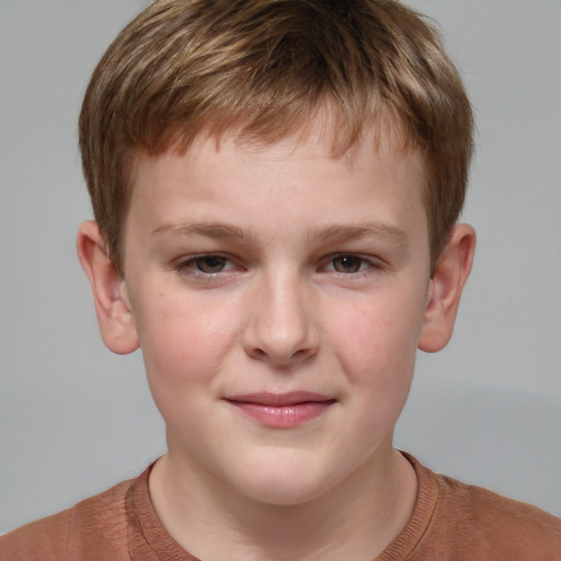 Joyful white child male with short  brown hair and grey eyes