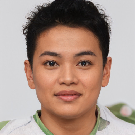 Joyful asian young-adult male with short  brown hair and brown eyes